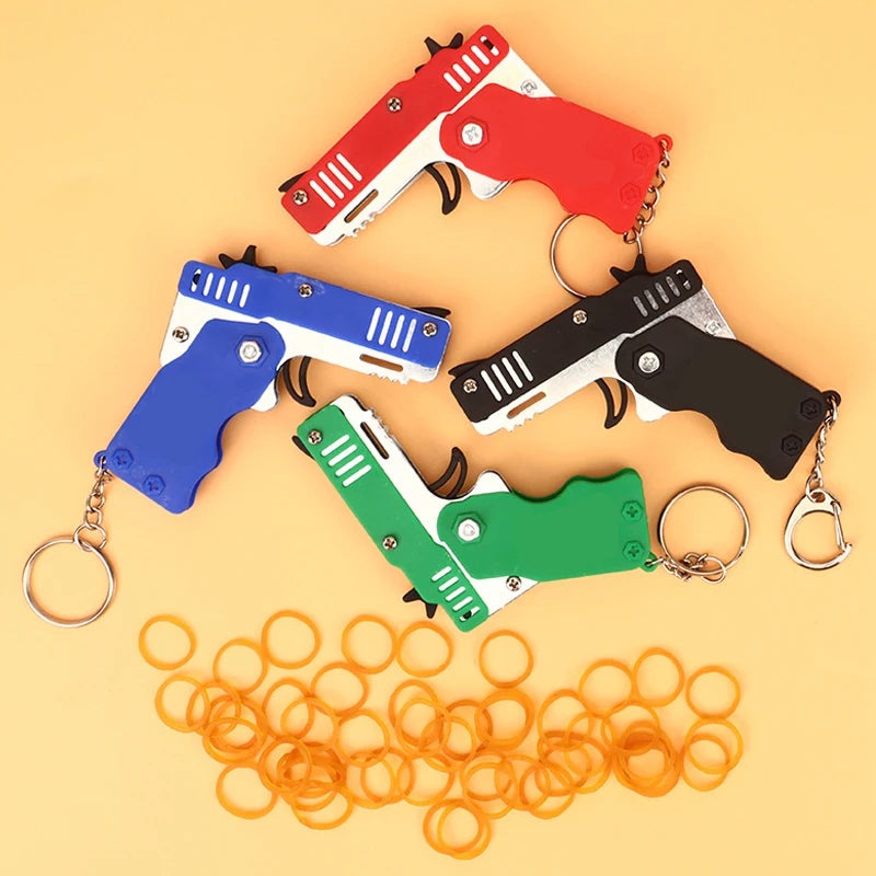 1PC Mini Keychain Gun Rubber Band Gun Toy Gun Shooting Pistol Alloy Kid Outdoor Activities Party Game Birthday Gift for Children